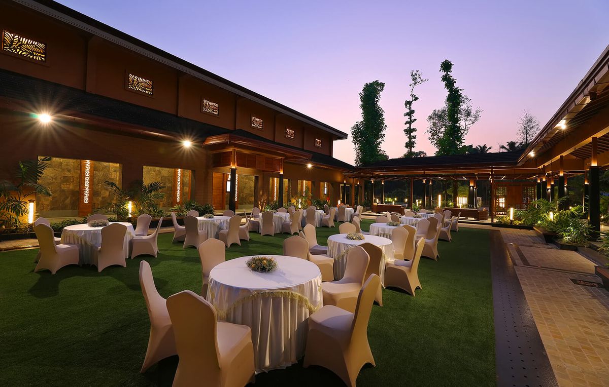Guests enjoying a well-planned party at a restaurant with an elegant table setup