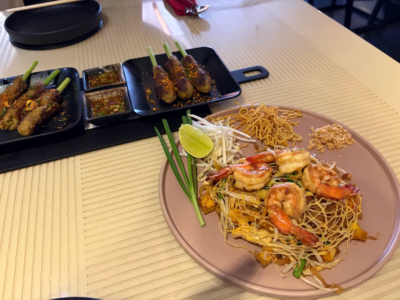 Yam Wun Sen Thai glass noodle salad with fresh vegetables, herbs, and flavorful toppings.