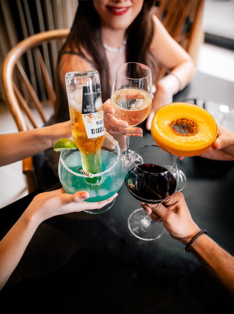 Friends enjoying drinks at Indulge Bangkok on Sukhumvit Road