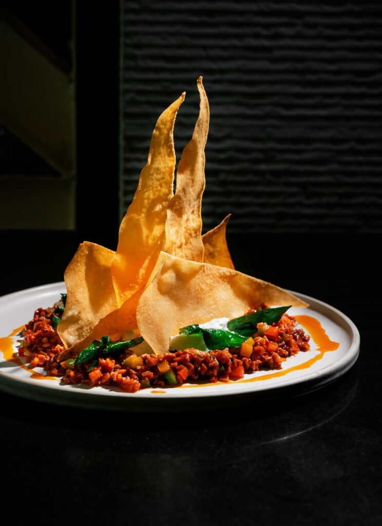 Spicy Chorizo with creamy labneh, crisp bread and fresh kale