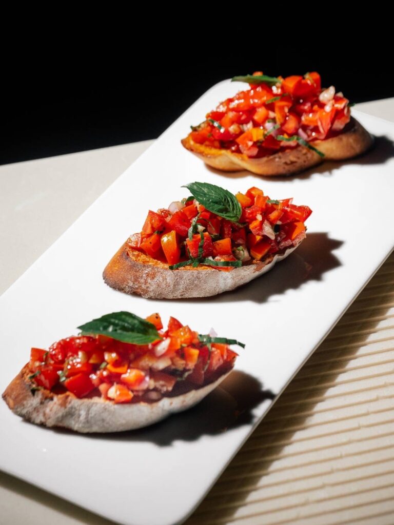 Bruschetta with fresh tomatoes, basil, olive oil and balsamic glaze