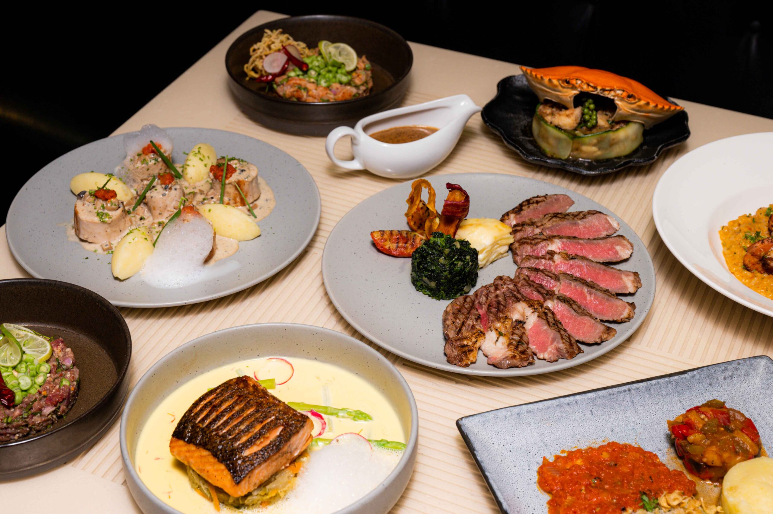 Signature mains and premium dinner dishes at Indulge Bangkok