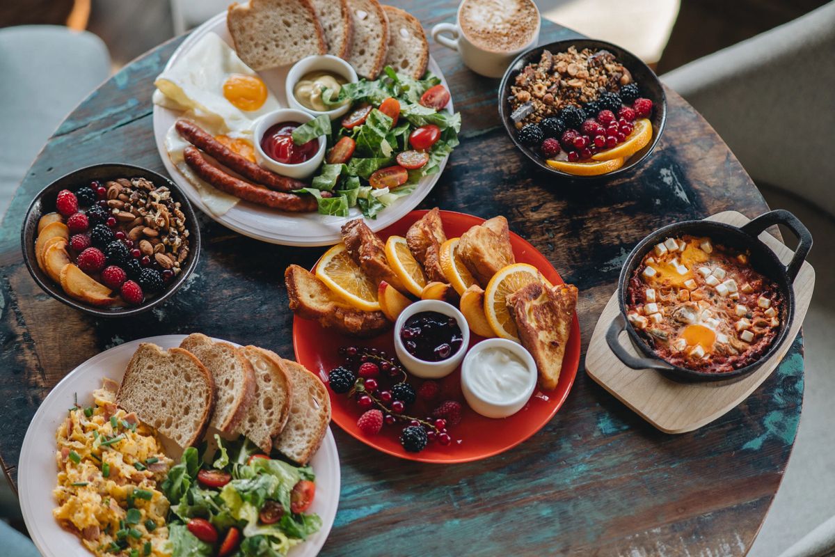 Brunch spread combining breakfast favorites with a variety of lunch dishes